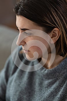 close up of sad crying woman at home