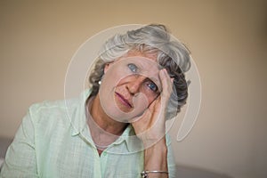 Close up of sad thoughtful senior woman at home
