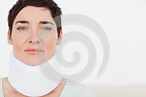 Close up of a sad Woman with a surgical collar