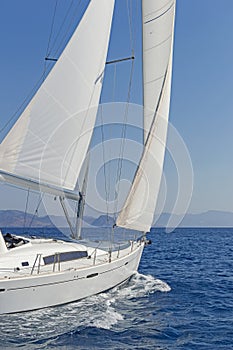 Close-up of a sailing yacht in action photo