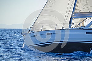 Close-up of a sailing yacht in action photo