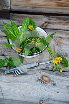 Close up salad leaves garden herbs and edible flowers. Healthy nutrition. Food background