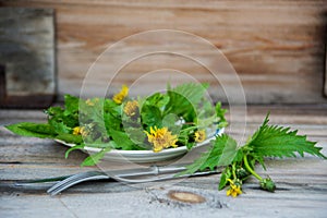 Close up salad leaves garden herbs and edible flowers. Healthy nutrition. Food background