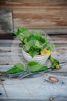 Close up salad leaves garden herbs and edible flowers. Healthy nutrition. Food background