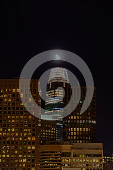 Close up of Salesforce tower san francisco with moon, night time