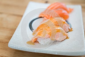 Close up salmon burned top with mayo in plate. Healthy Japanese Nigiri Aburi Sushi style with rice and fish in Japanese food