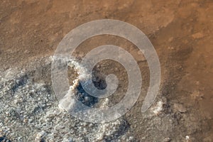 Close up of salt evaporation pools with lye