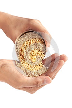 Close-Up of Salty plane Bhujia In handmade  handcraft  brown paper cone bag in hand ready to eat, made with Chickpeas or gram