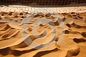 close-up of sand lines and net on an unattended court