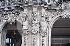 Close-up of sandstone sculptures of satyrs as atlantes