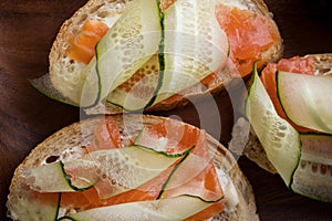 Close-up sandwich with cheese, salmon and cucumber