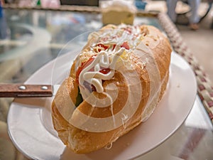 Close up Sandwich topup with mayonnaise and tomato sauce in breakfast restaurant