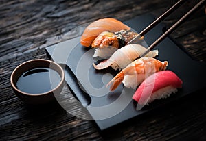 Close up of sashimi sushi set with chopsticks and soy