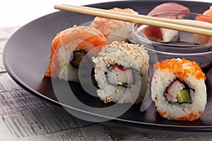 close up of sashimi sushi set with chopsticks and soy photo