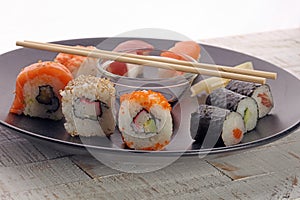 close up of sashimi sushi set with chopsticks and soy photo