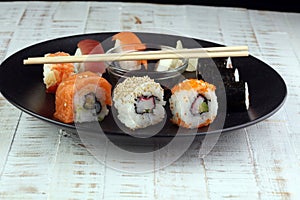 close up of sashimi sushi set with chopsticks and soy photo