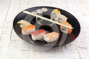 close up of sashimi sushi set with chopsticks and soy photo