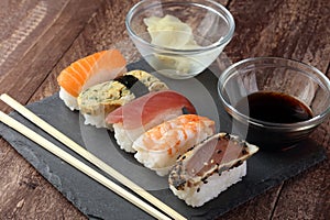 close up of sashimi sushi set with chopsticks and soy photo