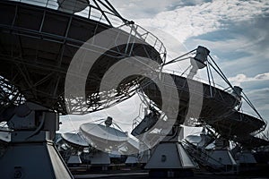 close-up of satellite dishes, transmitting data from orbit