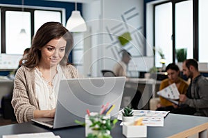 Close up of satisfied businesswoman answering email