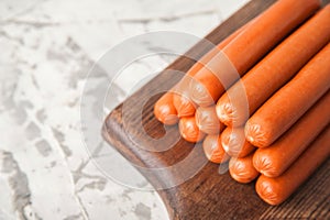 Close-up of sausages. Sausages on the blackboard and place for text. Boiled raw bavarian sausages and copy space