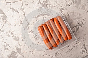 Close-up of sausages. Sausages in plastic and place for text. Boiled raw bavarian sausages and copy space