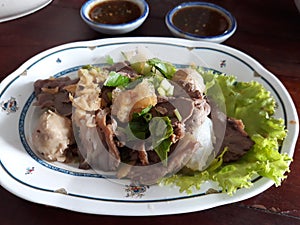 Close up, scalded beef, spicy sauce and fresh vegetables