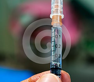 Close up scale o  tuberculin syringe and  background of patients unit in hospital.