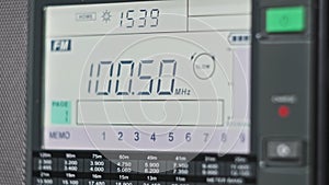 Close-up Scanning FM Frequency on Digital LCD Scale of Modern Portable Radio