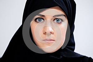 Close-up of scared muslim woman