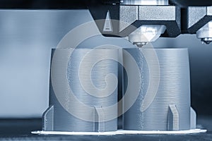 Close up scene the additive manufacturing by 3D printer machine photo