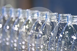 Close up scene of the empty drinking water bottles  on the conveyor belt for filling process