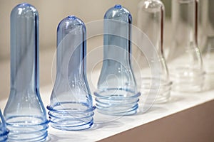 The close up scene of group of preform shape of PET bottle products.