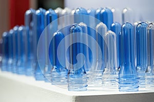 The close up scene of group of preform shape of PET bottle products