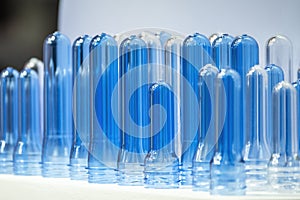 Close up scene of group of preform shape of PET bottle products