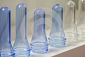 Close up scene of group of preform shape of PET bottle products