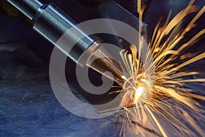 Close up scene the laser welding process by hand held laser welding machine