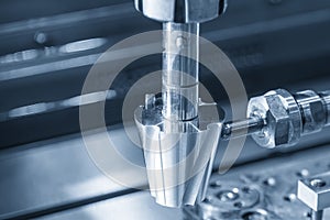 The close up scene the sinker EDM machine operation in the light blue scene