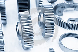 The close-up scene of transmission gear parts separation in the light blue scene.