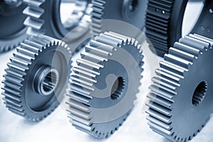 The close-up scene of various type of  the pinion gear parts shaft  in the light blue scene.