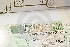 Close-up Schengen visa in a passport.