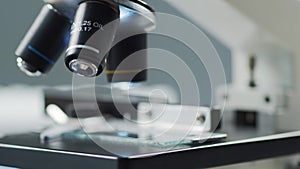 Close-up of scientific microscope. Laboratory in hospital. Epidemic disease, healthcare, vaccine research and