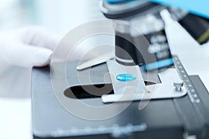 Close up of scientist hand with test sample in lab