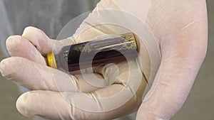 Close up of scientist holding bottle of vaccine developed for corona virus. Covid-19 antidote. Doctor discovers treatment for