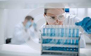 Close up.scientist with vial photo