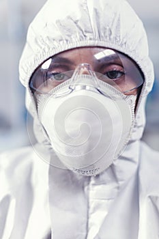 Close up of scientist woman dressed in coverall