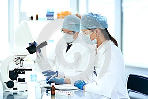 Close up. scientists conduct research in a modern laboratory .