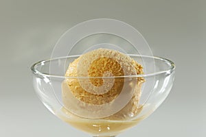 Close up of Scoop of delicious real fresh ice cream in Mango flavour.