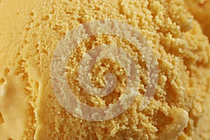 Close up of Scoop of delicious real fresh ice cream in Mango flavour.