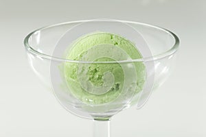 Close up of Scoop of delicious real fresh ice cream in Pistachio flavour. photo